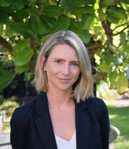 Blond woman in black jacket