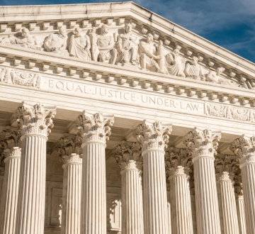 The facade of the U.S. Supreme Court building with “Equal Justice Under the Law“ visible at the top